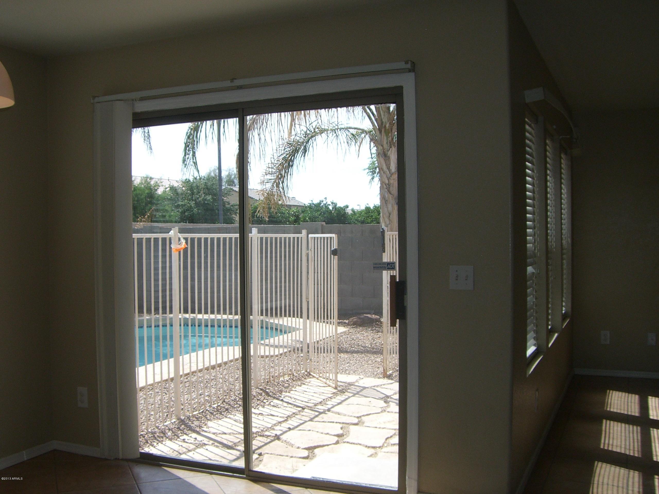 3281 South Martingale Road Gilbert, AZ 85297 - Photo 8 of 34 PATIO DOOR LOOKS OUT TO THE POOL