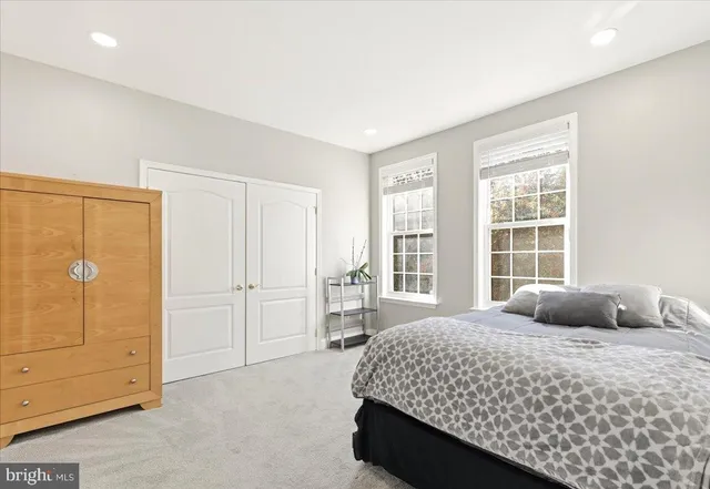 a bedroom with a bed and with cabinets