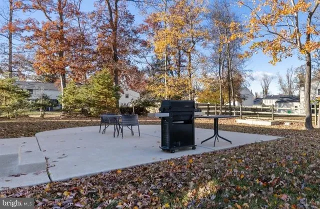 a view of a house with swimming pool and sitting area