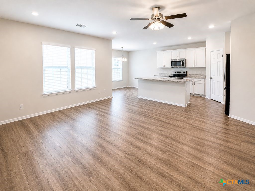 1507 Merritt Road Temple, TX 76504 - Photo 5 of 15 a view of kitchen with refrigerator microwave and stove