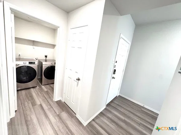 a view of hallway with washer and dryer