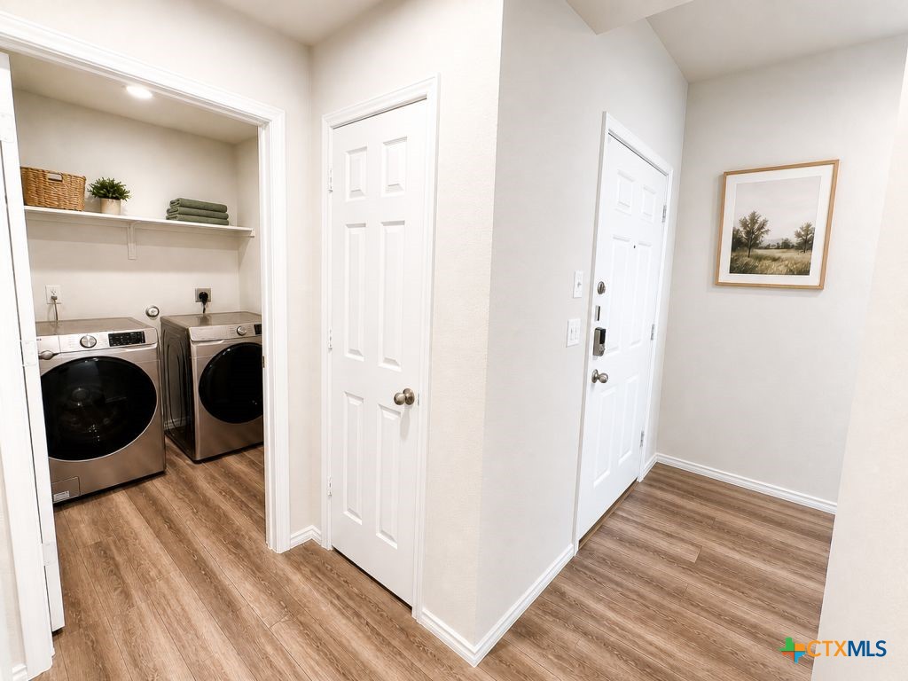 1507 Merritt Road Temple, TX 76504 - Photo 10 of 15 a view of a hallway with washer and dryer