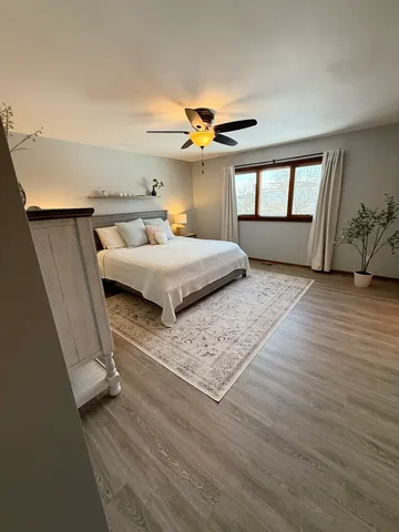 a bedroom with a bed and window