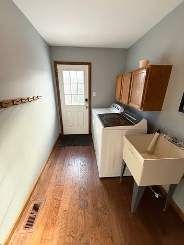 a view of a room that has a couch and a table in it