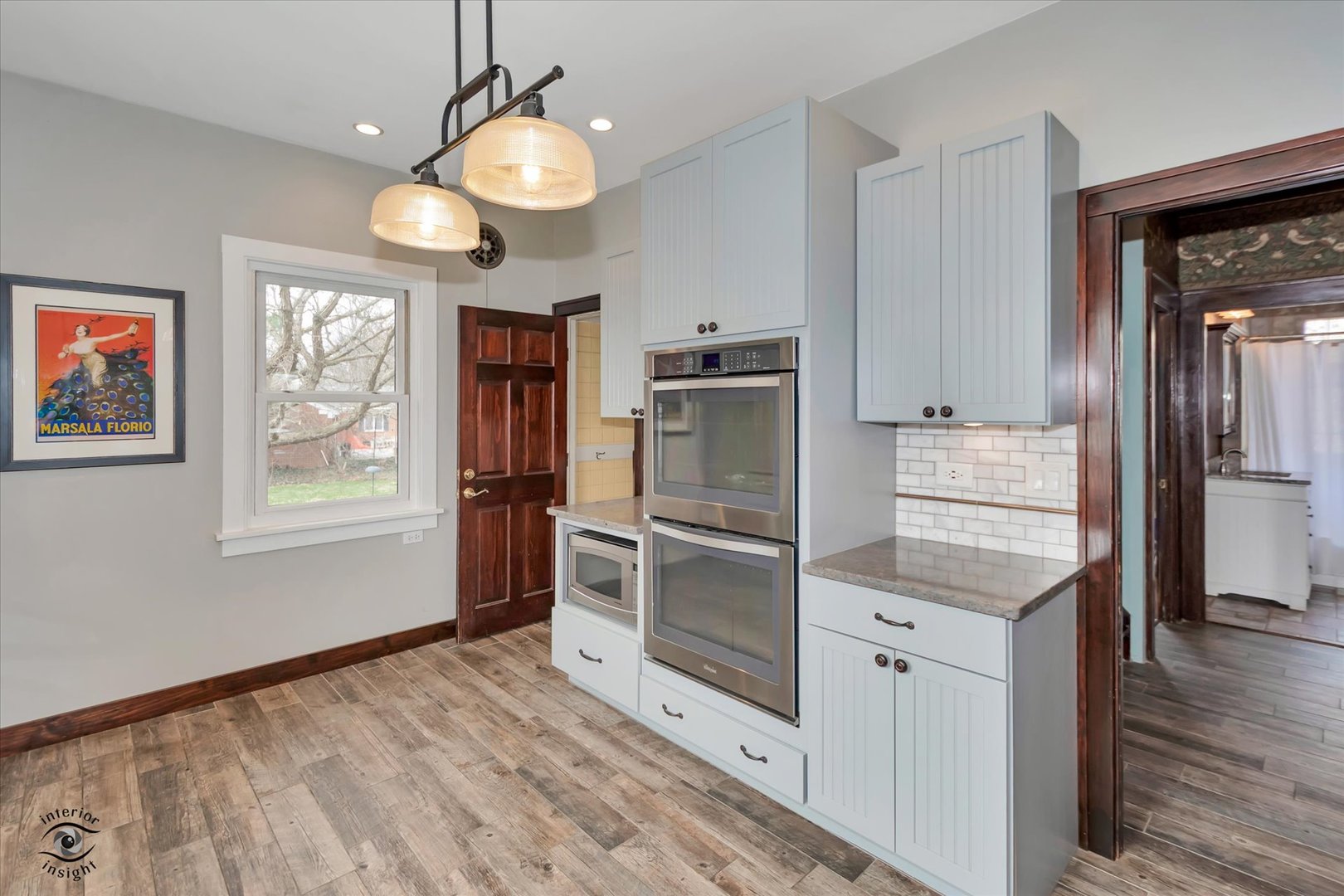 256 Center Road Frankfort, IL 60423 - Photo 11 of 26 a kitchen with granite countertop a refrigerator and a stove top oven