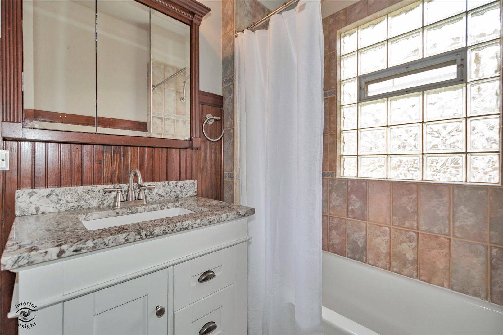 256 Center Road Frankfort, IL 60423 - Photo 15 of 26 a bathroom with a granite countertop sink and a window