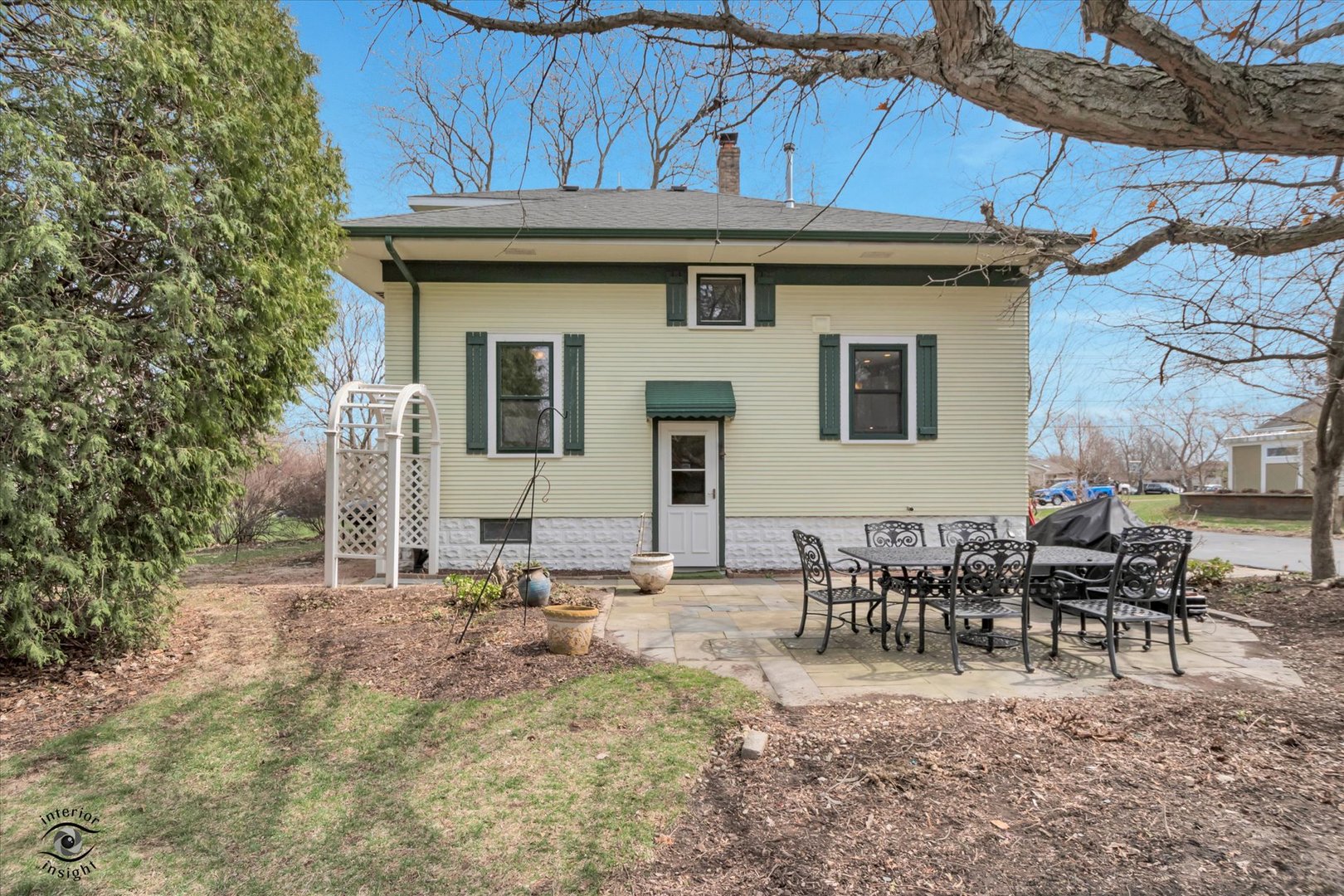 256 Center Road Frankfort, IL 60423 - Photo 2 of 26 a view of a dinning tables and chairs in backyard of the house