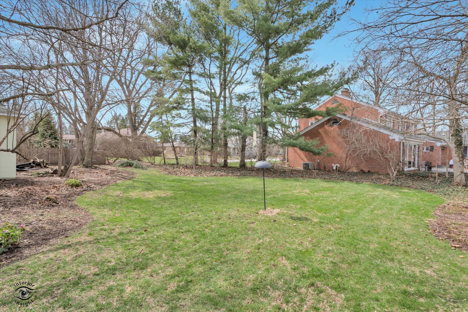256 Center Road Frankfort, IL 60423 - Photo 4 of 26 a view of a backyard with large trees