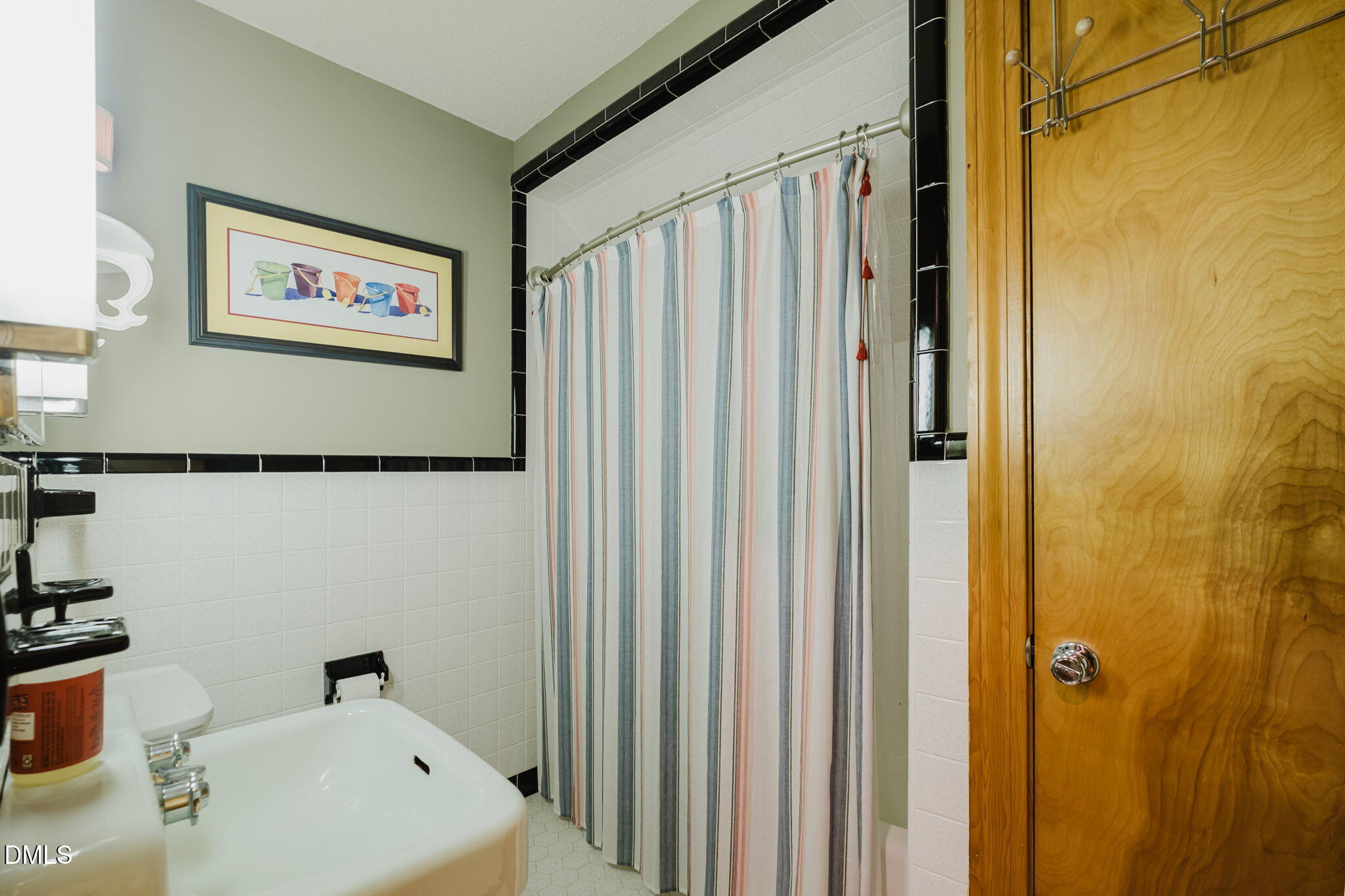 370 Robinson Ferry Road Macon, NC 27551 - Photo 51 of 85 a bathroom with a sink and a mirror