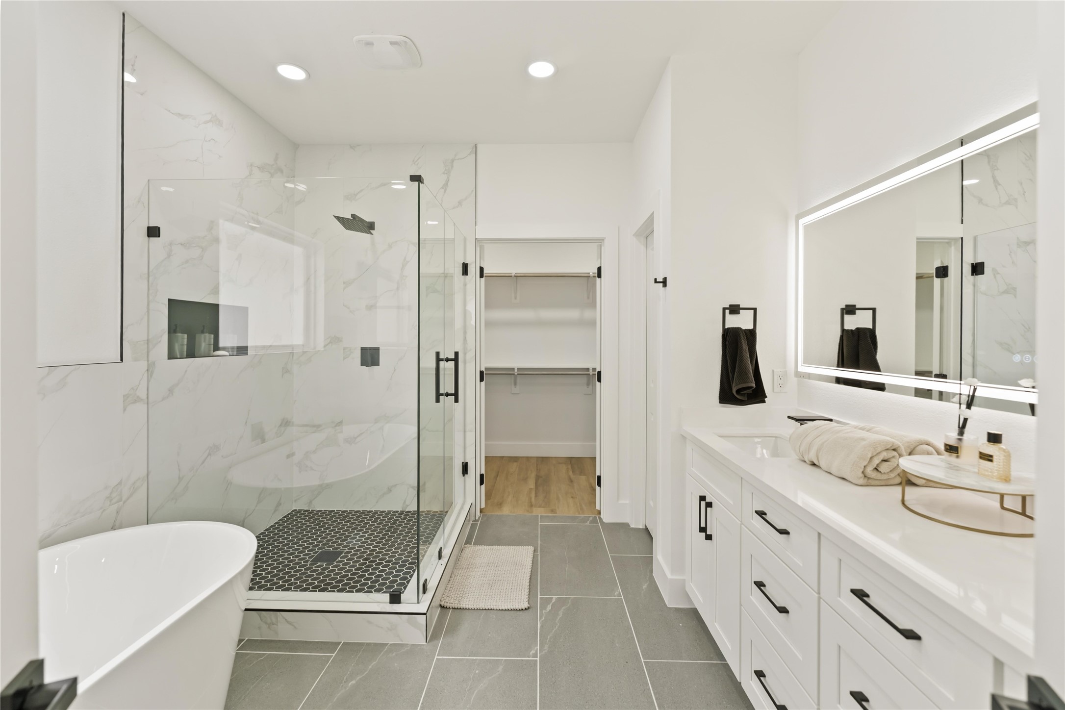 6539 Sealey Street Houston, TX 77091 - Photo 19 of 28 a bathroom with a sink a toilet and shower