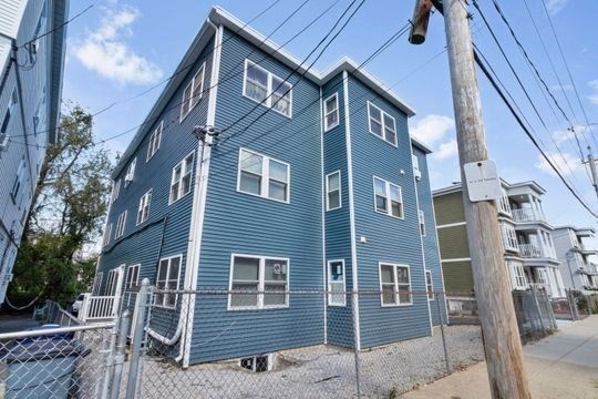 17 Greendale Road, Unit 2F Boston, MA 02126 - Photo 4 of 26 a front view of a house with a yard