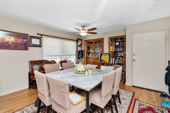 17 Greendale Road, Unit 2F Boston, MA 02126 - Photo 6 of 26 a view of a dining room with furniture and wooden floor