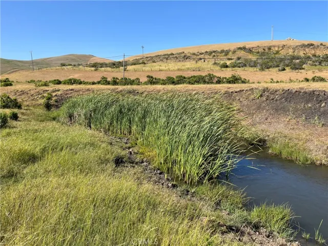 a view of ocean with a mountain