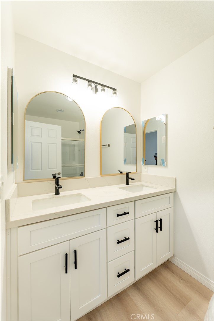 16925 Nanticoke Road Apple Valley, CA 92307 - Photo 36 of 87 a spacious bathroom with a double vanity sink and mirror