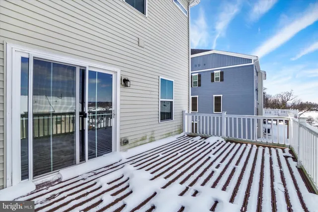 a view of a balcony with wooden floor