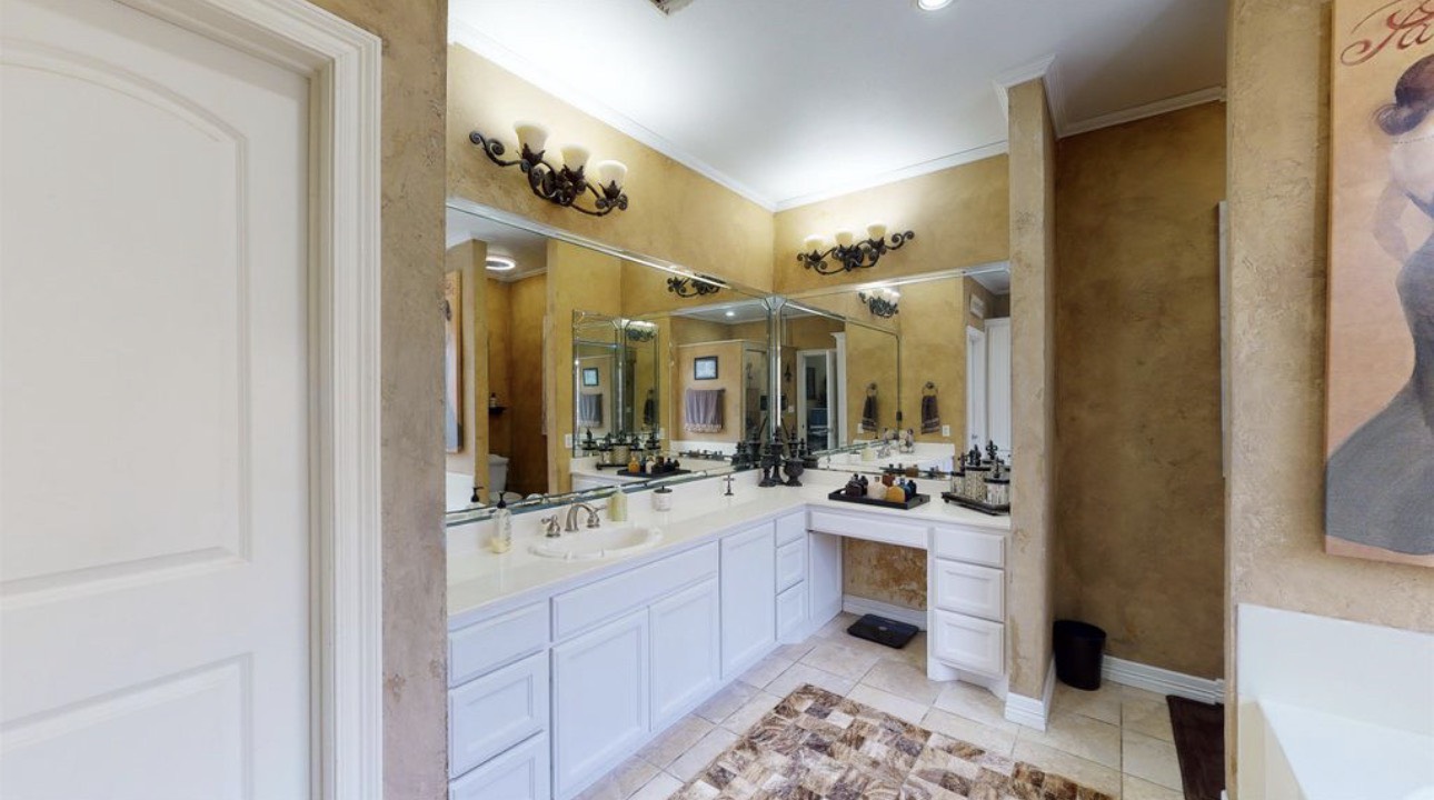 104 Mockingbird Lane Bridge City, TX 77611 - Photo 15 of 27 a bathroom with a double vanity sink mirror and double