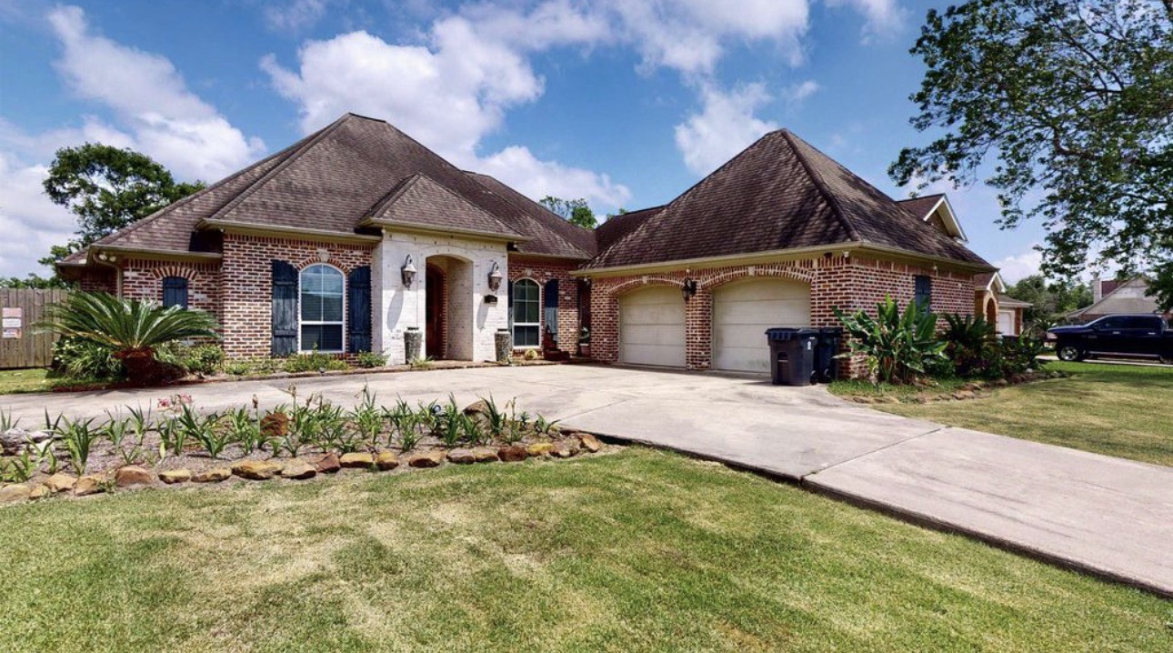 104 Mockingbird Lane Bridge City, TX 77611 - Photo 27 of 27 a front view of a house with a garden