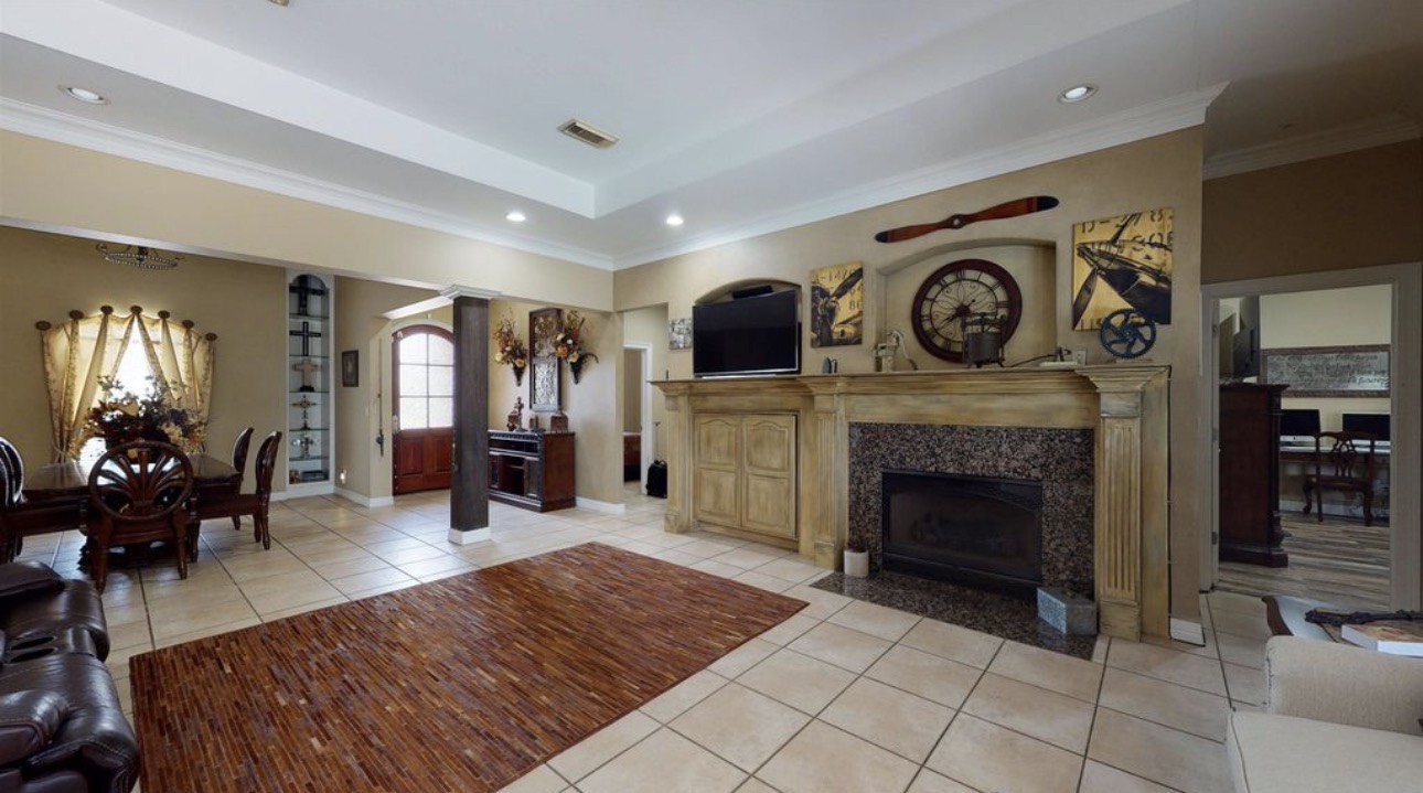 104 Mockingbird Lane Bridge City, TX 77611 - Photo 6 of 27 a living room with furniture and a fireplace