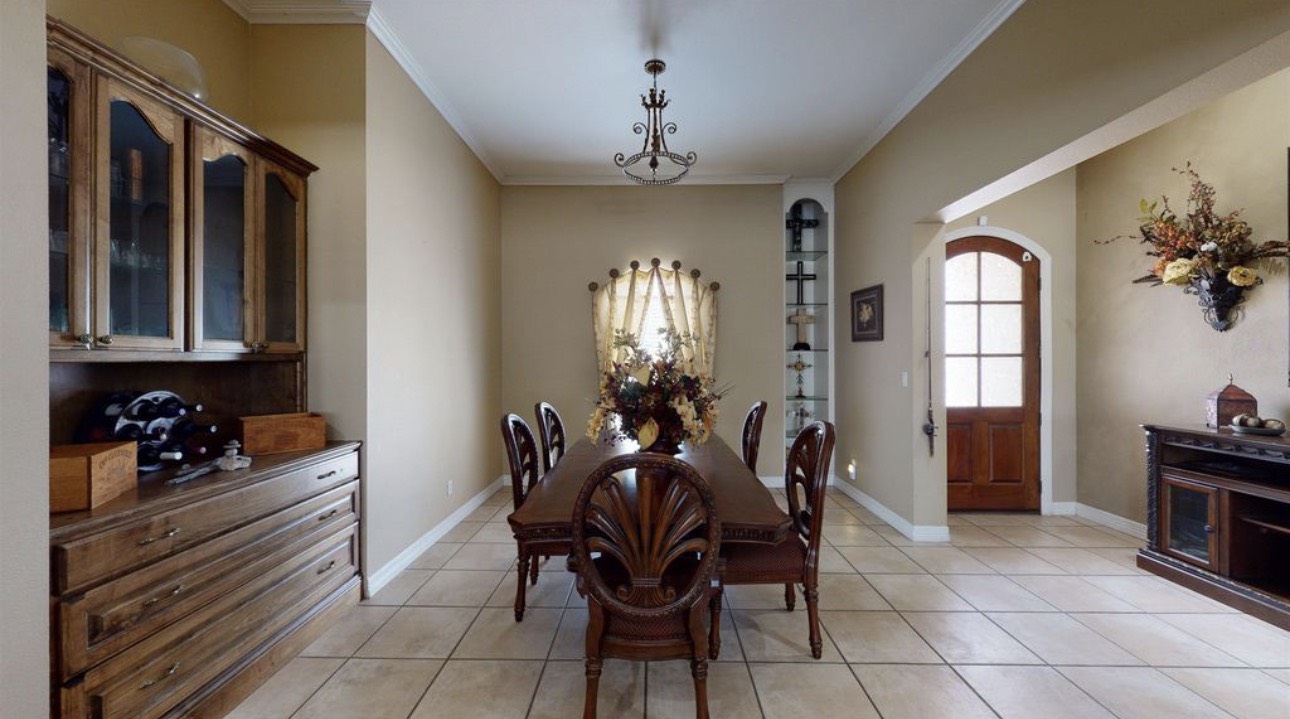 104 Mockingbird Lane Bridge City, TX 77611 - Photo 8 of 27 a view of a dining room with furniture and chandelier