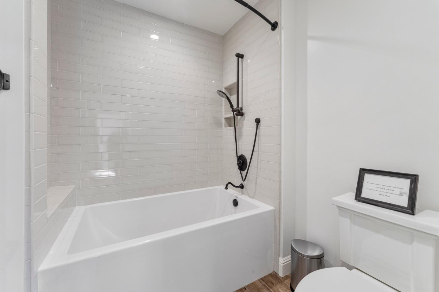 1080 Finley Road Pleasanton, CA 94588 - Photo 49 of 85 a white bath tub sitting next to a toilet