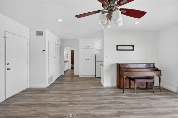 a kitchen with a sink and a refrigerator