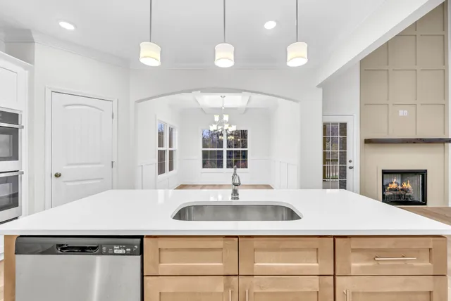 a kitchen with a sink and a refrigerator