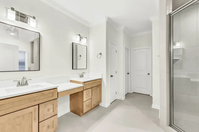 a spacious bathroom with a double vanity sink mirror and double