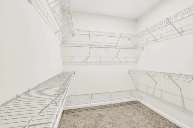 a bathroom with a sink toilet vanity and shower