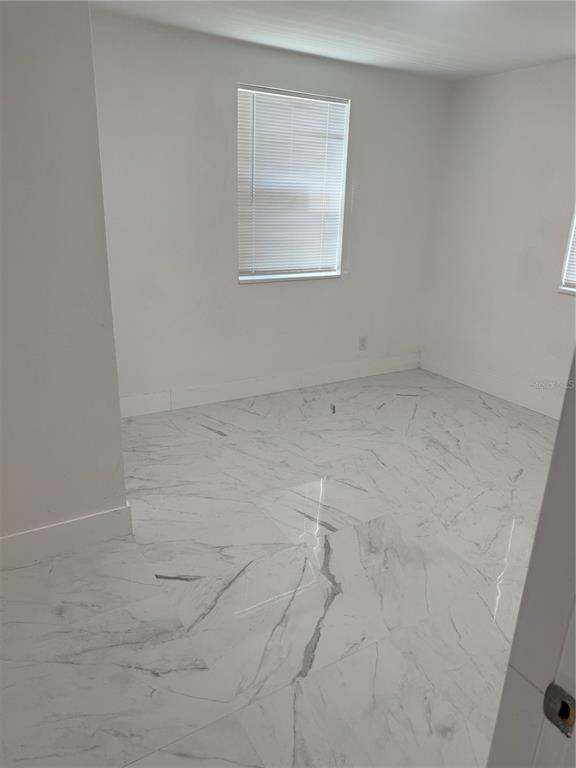 305 Ann Street Edgewater, FL 32132 - Photo 17 of 45 an empty room with a window