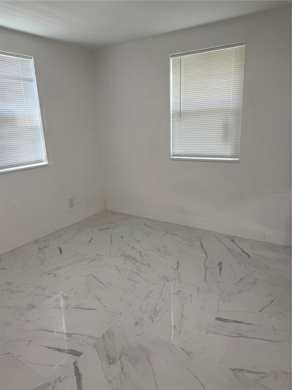 305 Ann Street Edgewater, FL 32132 - Photo 18 of 45 an empty room with a window