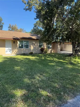 a view of a trees in front of a house