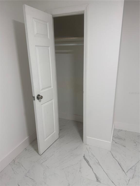 305 Ann Street Edgewater, FL 32132 - Photo 23 of 45 an empty room with a door