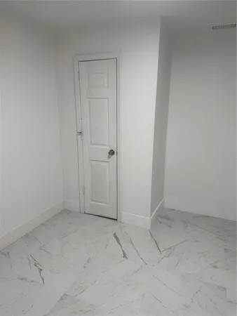 a view of a kitchen with electric appliances