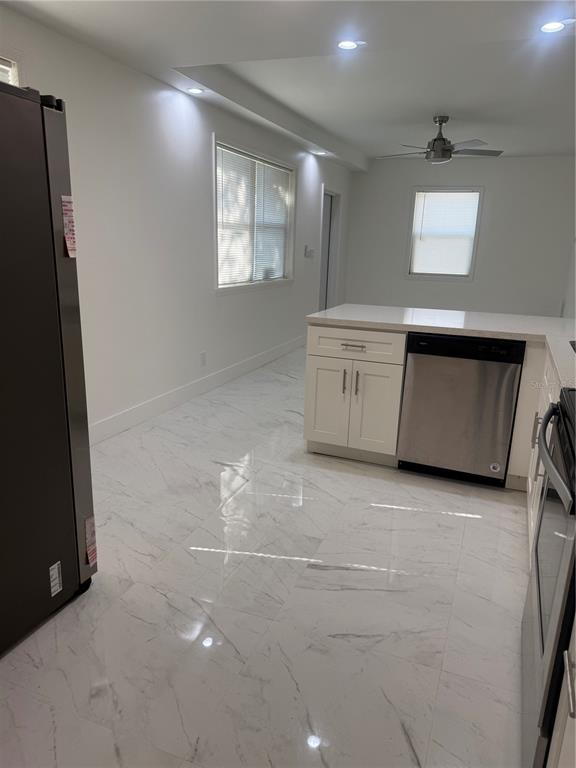 305 Ann Street Edgewater, FL 32132 - Photo 28 of 45 a view of a refrigerator and window in a room