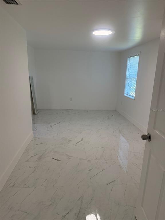 305 Ann Street Edgewater, FL 32132 - Photo 33 of 45 en empty room with windows