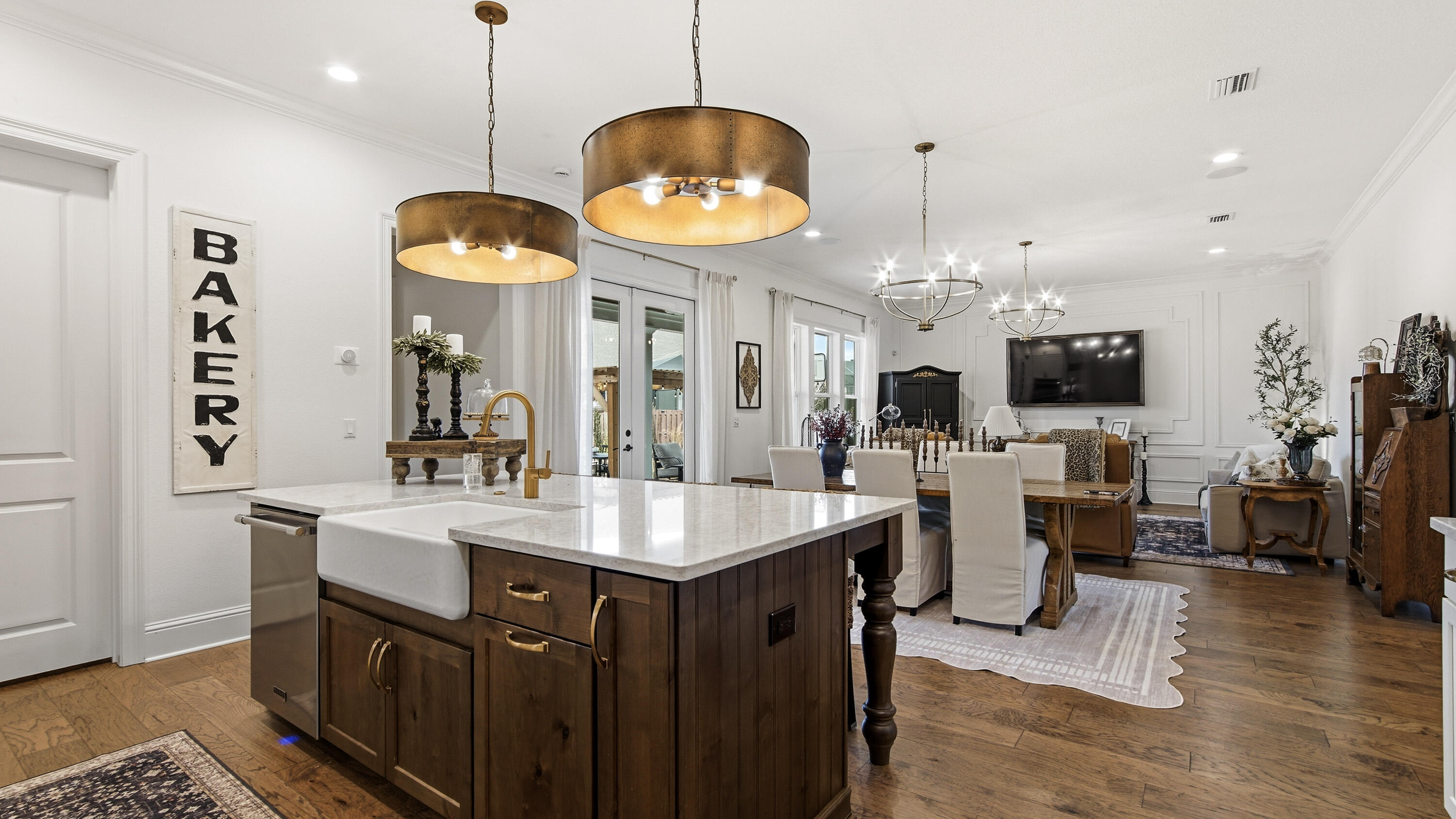 33 Caymus Cove Freeport, FL 32439 - Photo 18 of 144 a kitchen with stainless steel appliances granite countertop a stove top oven a sink dishwasher and a dining table with wooden floor