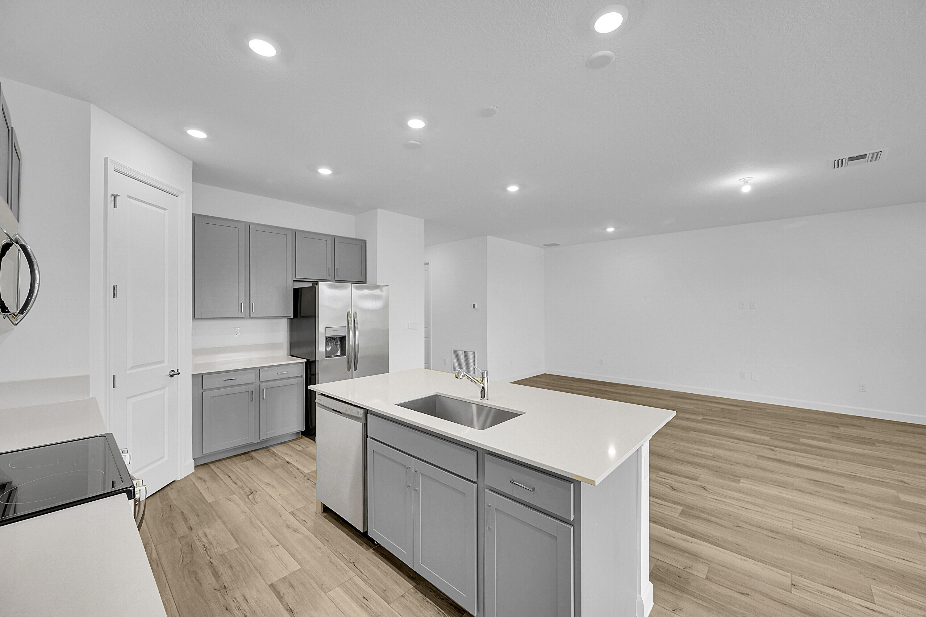 3501 Harborside Avenue Fort Pierce, FL 34946 - Photo 19 of 31 a kitchen with a sink refrigerator and cabinets