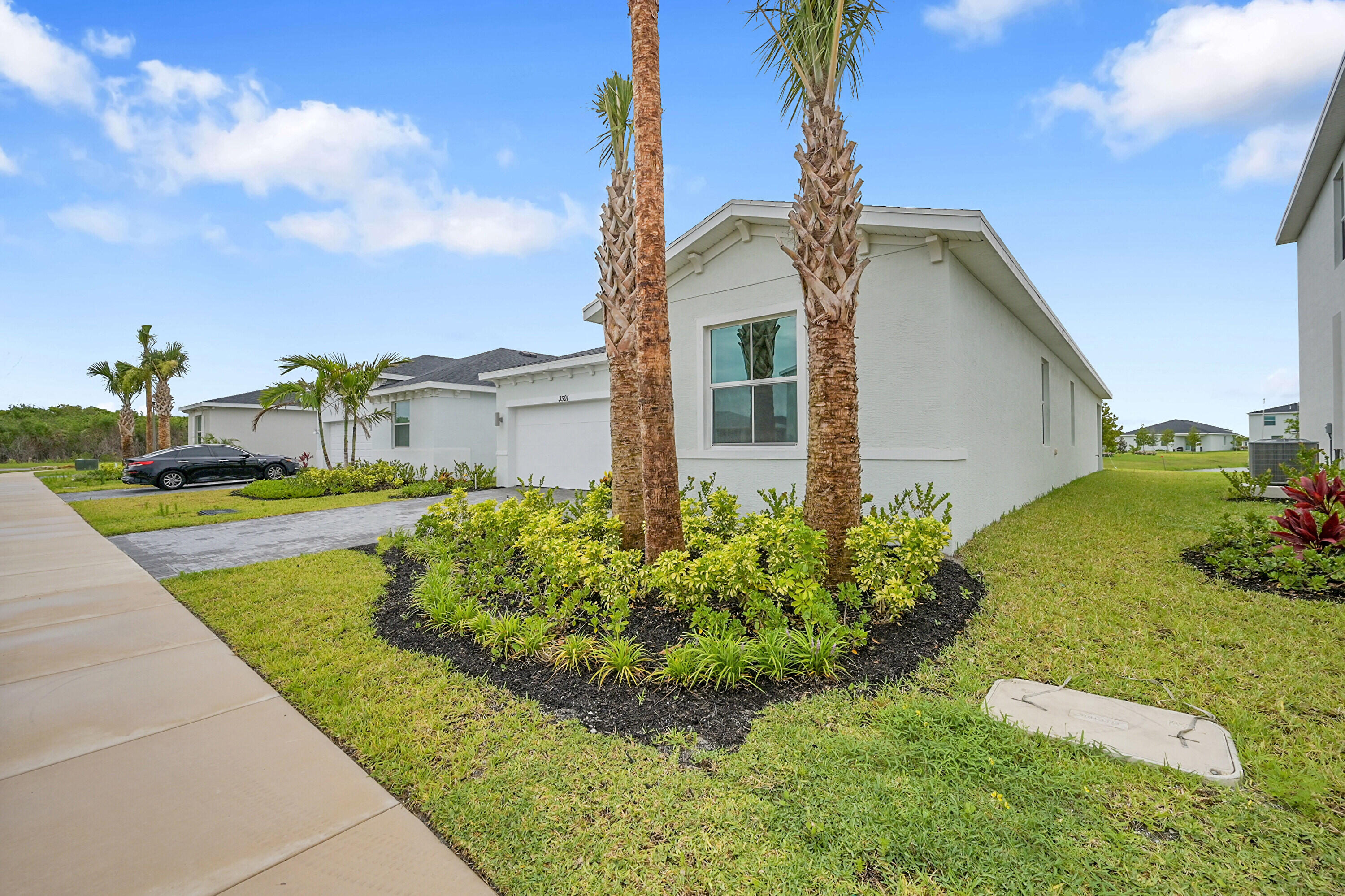 3501 Harborside Avenue Fort Pierce, FL 34946 - Photo 2 of 31 a front view of a house with garden