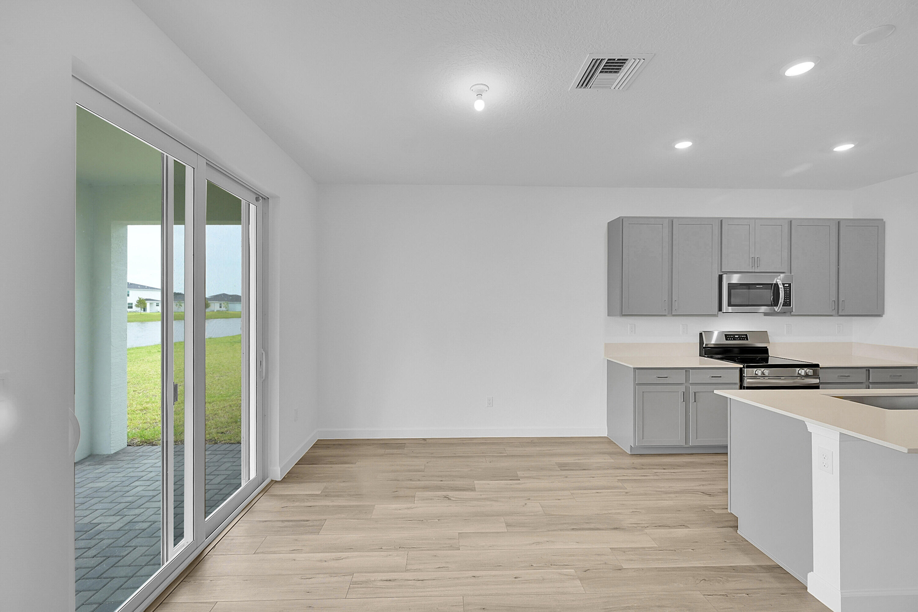 3501 Harborside Avenue Fort Pierce, FL 34946 - Photo 25 of 31 a kitchen with stainless steel appliances granite countertop a stove a sink and a refrigerator