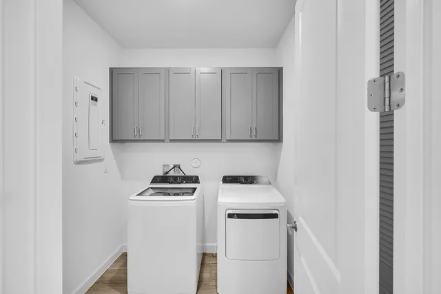 a view of storage and utility room with washer and dryer