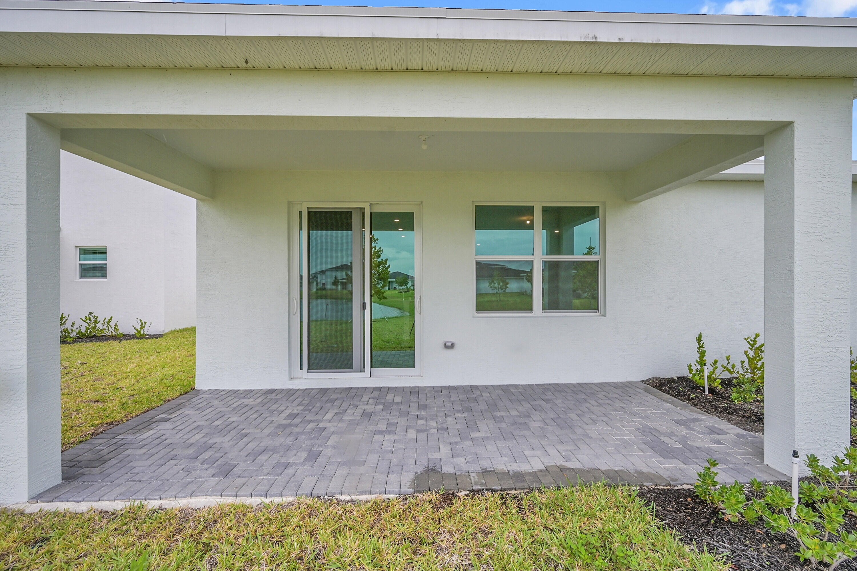 3501 Harborside Avenue Fort Pierce, FL 34946 - Photo 28 of 31 a front view of a house with a yard
