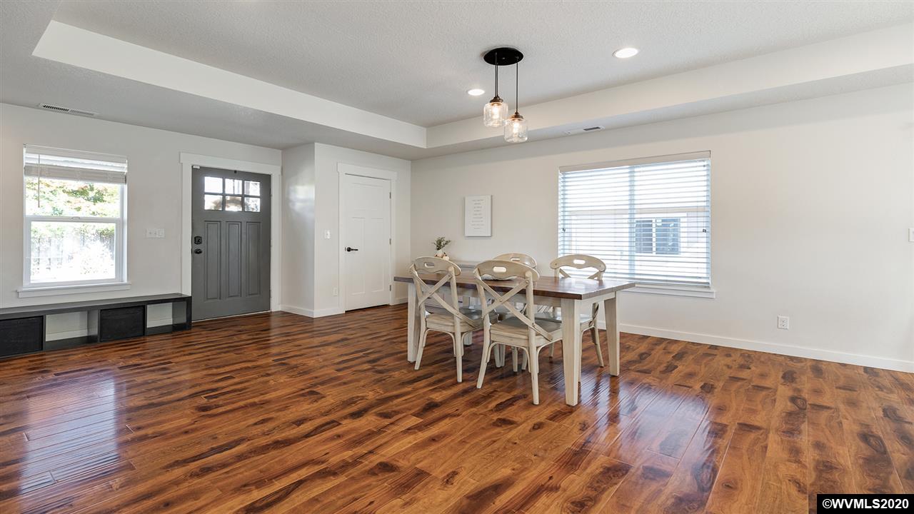 790 Southeast Fir Villa Road Dallas, OR 97338 - Photo 6 of 38 a view of a dining room with furniture window and wooden floor