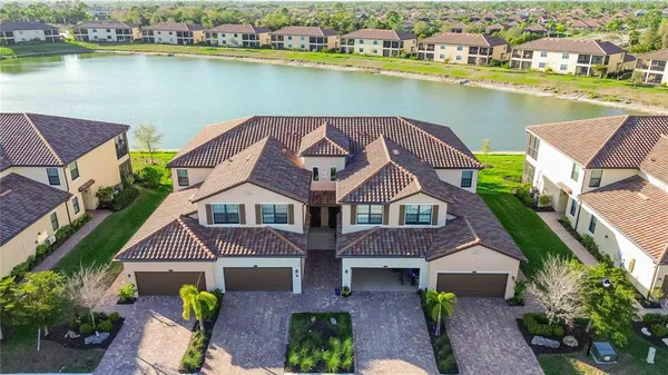 an aerial view of a house with a ocean view