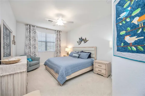 a bedroom with a large bed and furniture