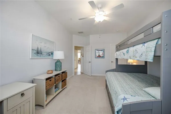 a spacious bathroom with a double vanity sink and a mirror