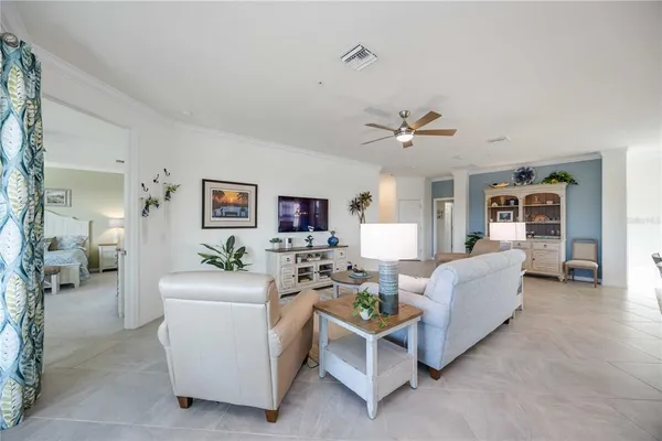 a large kitchen with stainless steel appliances lots of counter space and a sink