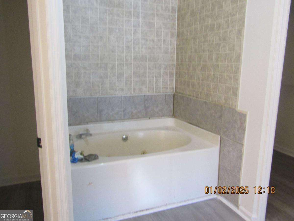 7358 Stilson-Leefield Road Brooklet, GA 30415 - Photo 12 of 24 a bath tub sitting next to a white sink