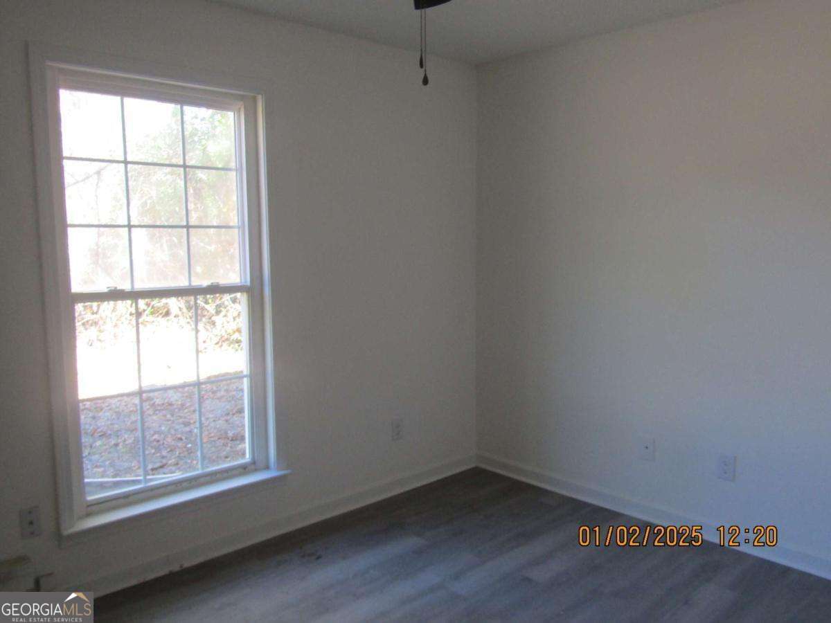 7358 Stilson-Leefield Road Brooklet, GA 30415 - Photo 13 of 24 an empty room with a window