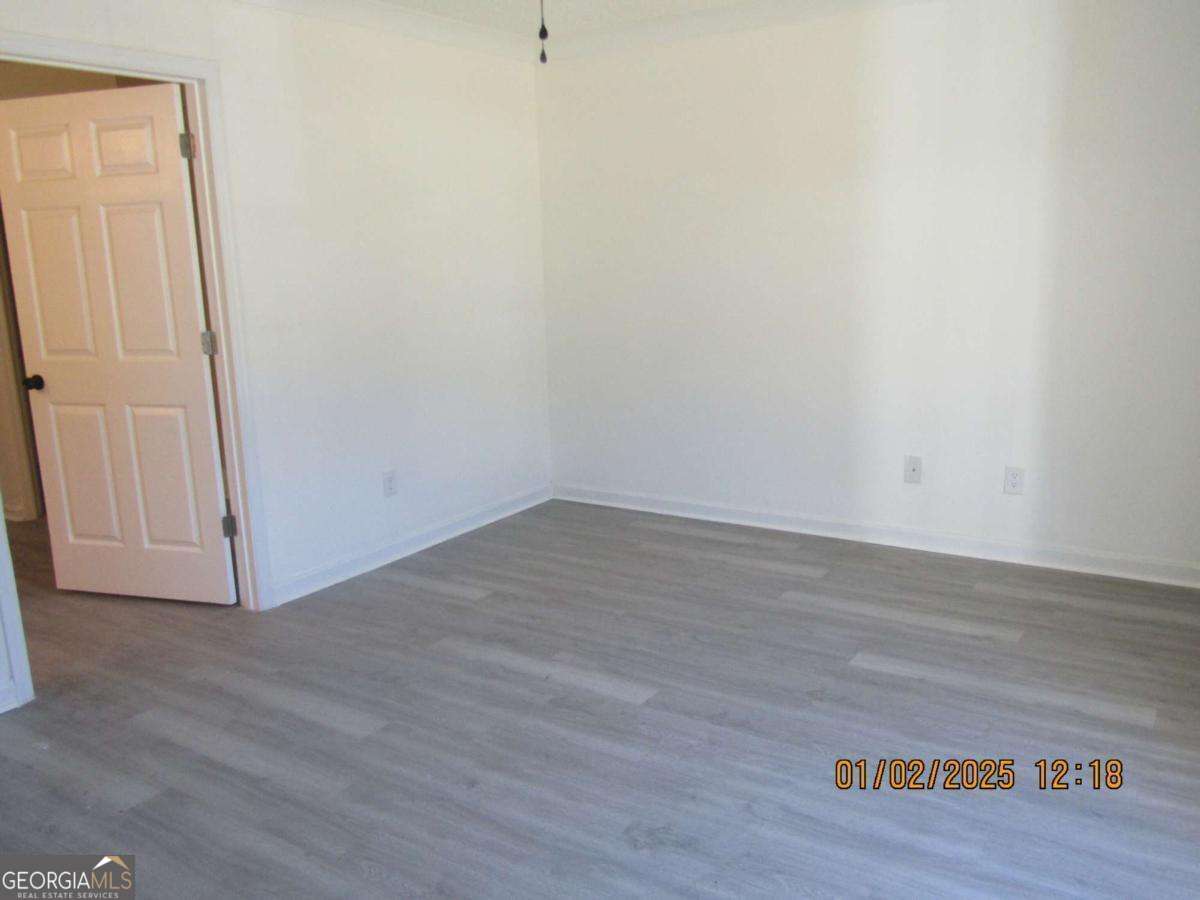 7358 Stilson-Leefield Road Brooklet, GA 30415 - Photo 16 of 24 a view of a small space with wooden floor