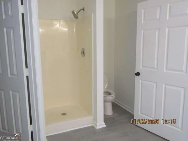a bathroom with a granite countertop sink